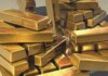 Золото дешевшає після першого за 3 роки підвищення ставки ФРС
