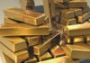 Золото впало до семитижневого мінімуму через загрозу нового підвищення ставок у США